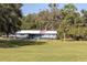 Ranch style home with metal roof and spacious yard at 3704 Warm Springs Ave, Wildwood, FL 34785