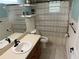 Clean bathroom with a shower/tub combo, vanity, and toilet at 403 W Palm Ave, Bushnell, FL 33513