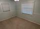 Bedroom with light green walls and ceiling fan at 403 W Palm Ave, Bushnell, FL 33513