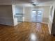 Dining room with hardwood floors and French doors at 403 W Palm Ave, Bushnell, FL 33513