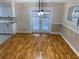 Dining area with hardwood floors and stylish light fixture at 403 W Palm Ave, Bushnell, FL 33513