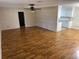 Spacious living room with hardwood floors and ceiling fan at 403 W Palm Ave, Bushnell, FL 33513