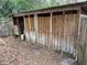 Wooden storage shed with multiple compartments at 403 W Palm Ave, Bushnell, FL 33513