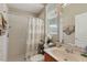 Clean bathroom with shower/tub combo and updated vanity at 4077 Greystone Dr, Clermont, FL 34711