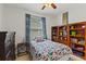 bedroom with built-in shelving and fun decor at 4077 Greystone Dr, Clermont, FL 34711