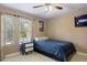 Bright bedroom with double bed and plenty of natural light at 4077 Greystone Dr, Clermont, FL 34711