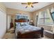 Cozy bedroom with a comfortable bed and ample closet space at 4077 Greystone Dr, Clermont, FL 34711