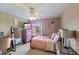 Bright bedroom with a double bed, dresser, and desk at 4077 Greystone Dr, Clermont, FL 34711