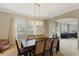 Dining room with table, chairs, and view into living room at 4077 Greystone Dr, Clermont, FL 34711