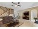 Spacious living room with hardwood floors, a large TV, and plenty of seating at 4077 Greystone Dr, Clermont, FL 34711