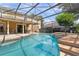 Large screened pool with extended patio and seating at 4077 Greystone Dr, Clermont, FL 34711