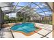 Screened pool and spa with plenty of room for relaxation at 4077 Greystone Dr, Clermont, FL 34711