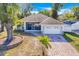 Aerial view of house with paver driveway and landscaping at 415 Renee Dr, Haines City, FL 33844