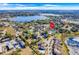 Aerial view showing house location near a lake and other homes at 415 Renee Dr, Haines City, FL 33844