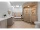 Spa-like bathroom featuring a walk-in shower and a soaking tub at 415 Renee Dr, Haines City, FL 33844