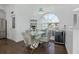 Breakfast nook with glass table and modern chairs, near a built-in bar at 415 Renee Dr, Haines City, FL 33844