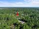 Aerial view showing home location in a wooded area at 42025 Royal Trails Rd, Eustis, FL 32736