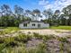 Single-Gathering home with modern exterior and backyard at 42025 Royal Trails Rd, Eustis, FL 32736