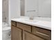Stylish bathroom featuring a white countertop, a brown vanity, and a subway-tiled wall for a clean, modern look at 5119 Firebush Dr, Apopka, FL 32712