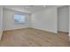 Bedroom features light-toned wood flooring and a window at 5119 Firebush Dr, Apopka, FL 32712