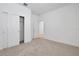 Bright bedroom includes closet and a door at 5119 Firebush Dr, Apopka, FL 32712