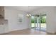 Light-filled dining area adjacent to the kitchen features sliding doors to the covered patio at 5119 Firebush Dr, Apopka, FL 32712