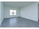 Bright living room featuring gray tile floors and large windows at 5119 Firebush Dr, Apopka, FL 32712