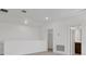 Bright loft space with neutral carpet and white walls, ready for flexible use as a study or play area at 5119 Firebush Dr, Apopka, FL 32712
