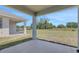 Covered patio overlooking a generous backyard is great for entertaining or relaxing outdoors at 5119 Firebush Dr, Apopka, FL 32712