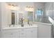 Bathroom boasts a double vanity and a large walk in shower at 5121 Blanket Flower St, Apopka, FL 32712