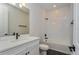 Clean bathroom with white vanity and a bathtub at 5155 Firebush Dr, Apopka, FL 32712