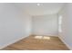 Bright bedroom with light hardwood floors and neutral walls at 5155 Firebrush Dr, Apopka, FL 32712