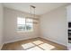 Bright dining room with large window and hardwood floors at 5155 Firebush Dr, Apopka, FL 32712