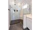 Large walk-in shower with marble tile and hexagon floor at 5155 Firebrush Dr, Apopka, FL 32712