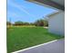 The home offers a spacious backyard with a view of a serene field, perfect for outdoor activities at 5155 Firebush Dr, Apopka, FL 32712