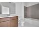 Bathroom with a shower-tub combo, vanity, mirror and tile floors at 5155 Firebush Dr, Apopka, FL 32712