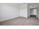 Bright, carpeted bedroom with a walk-in closet and neutral color scheme at 5155 Firebush Dr, Apopka, FL 32712