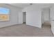 Bedroom with neutral carpet, natural light, and a walk-in closet at 5155 Firebush Dr, Apopka, FL 32712