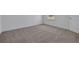 Bedroom with neutral carpet and white trim at 5155 Firebush Dr, Apopka, FL 32712
