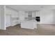 Bright kitchen features a large center island, stainless steel appliances, and ample cabinet space, perfect for cooking and entertaining at 5155 Firebush Dr, Apopka, FL 32712