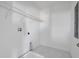 A utility room with white walls, white marble tile floors and a utility sink at 5155 Firebush Dr, Apopka, FL 32712