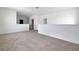 Loft area with neutral carpet and white walls at 5155 Firebush Dr, Apopka, FL 32712