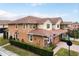 Townhouse exterior with landscaping and American flag at 5448 Via Appia Way, Sanford, FL 32771