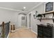 Upstairs hallway with decorative shelving and hardwood floors at 5448 Via Appia Way, Sanford, FL 32771