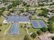 Aerial view of community amenities including pool, tennis courts, and clubhouse at 5502 Bounty Cir, Tavares, FL 32778