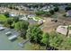 Aerial view of waterfront homes and community landscape at 5502 Bounty Cir, Tavares, FL 32778