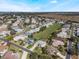 Aerial view of community featuring a large empty lot at 5502 Bounty Cir, Tavares, FL 32778