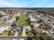 Wide aerial view of neighborhood with green space at 5502 Bounty Cir, Tavares, FL 32778