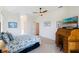 Spacious bedroom with desk and ocean-themed bedding at 5502 Bounty Cir, Tavares, FL 32778