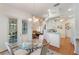 Bright breakfast nook with glass table and French doors at 5502 Bounty Cir, Tavares, FL 32778